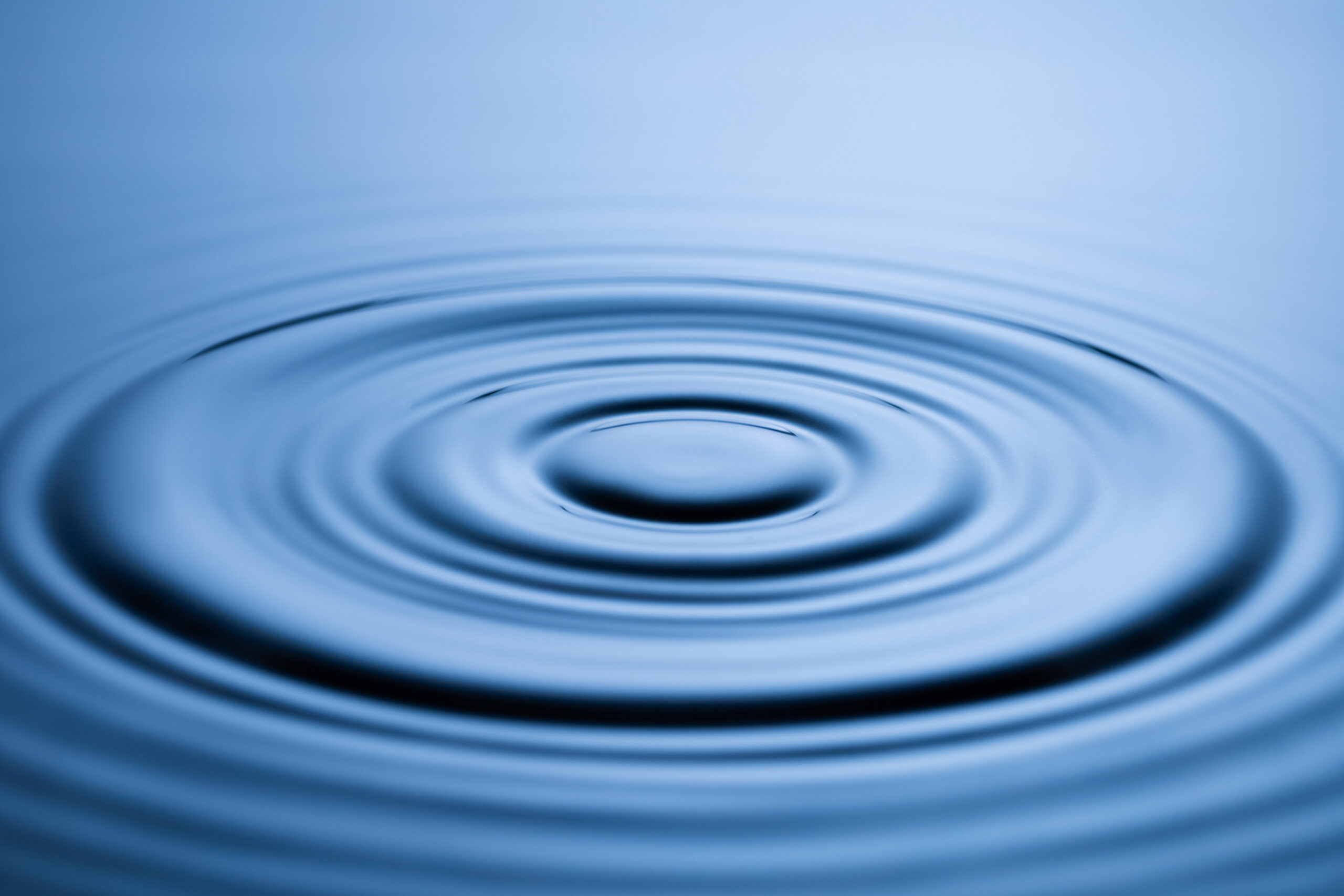 Blue Water drop falling, macro splash. Natural background Blue Water drop falling, macro splash. Natural background.